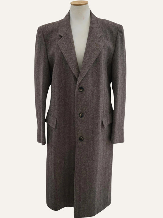 Brown coat on a mannequin against a white background