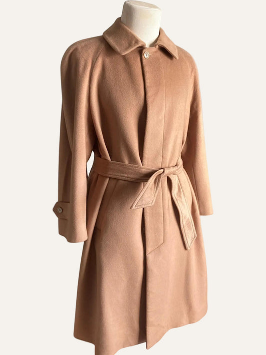 Brown coat on a mannequin against a white background