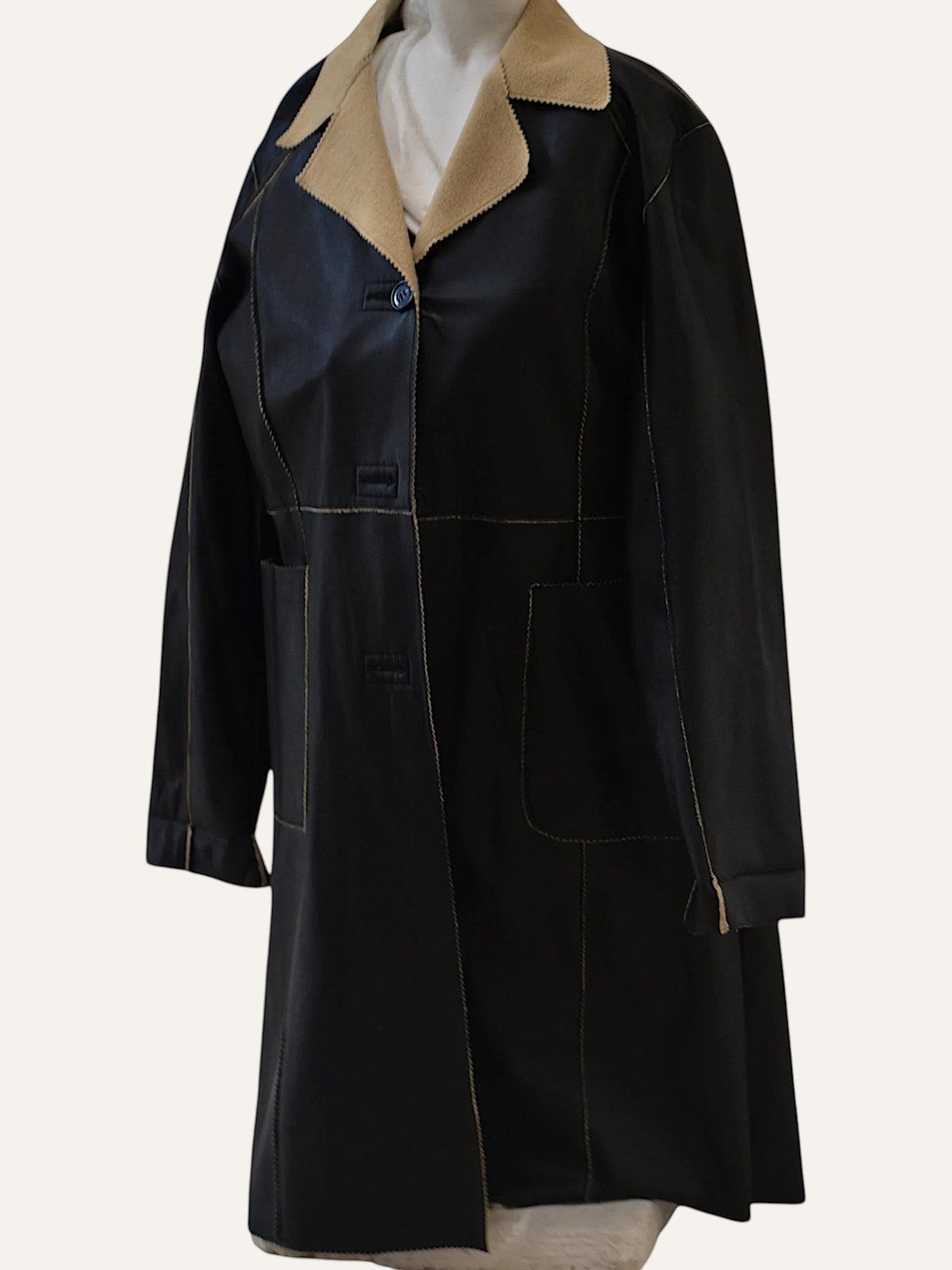 Anemoia Vestiaire black faux leather longline coat with tan collar, contrast stitching, and front pockets.