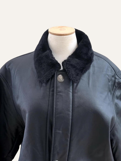 Anemoia Vestiaire black leather long coat with black eco fur collar and silver snap buttons.