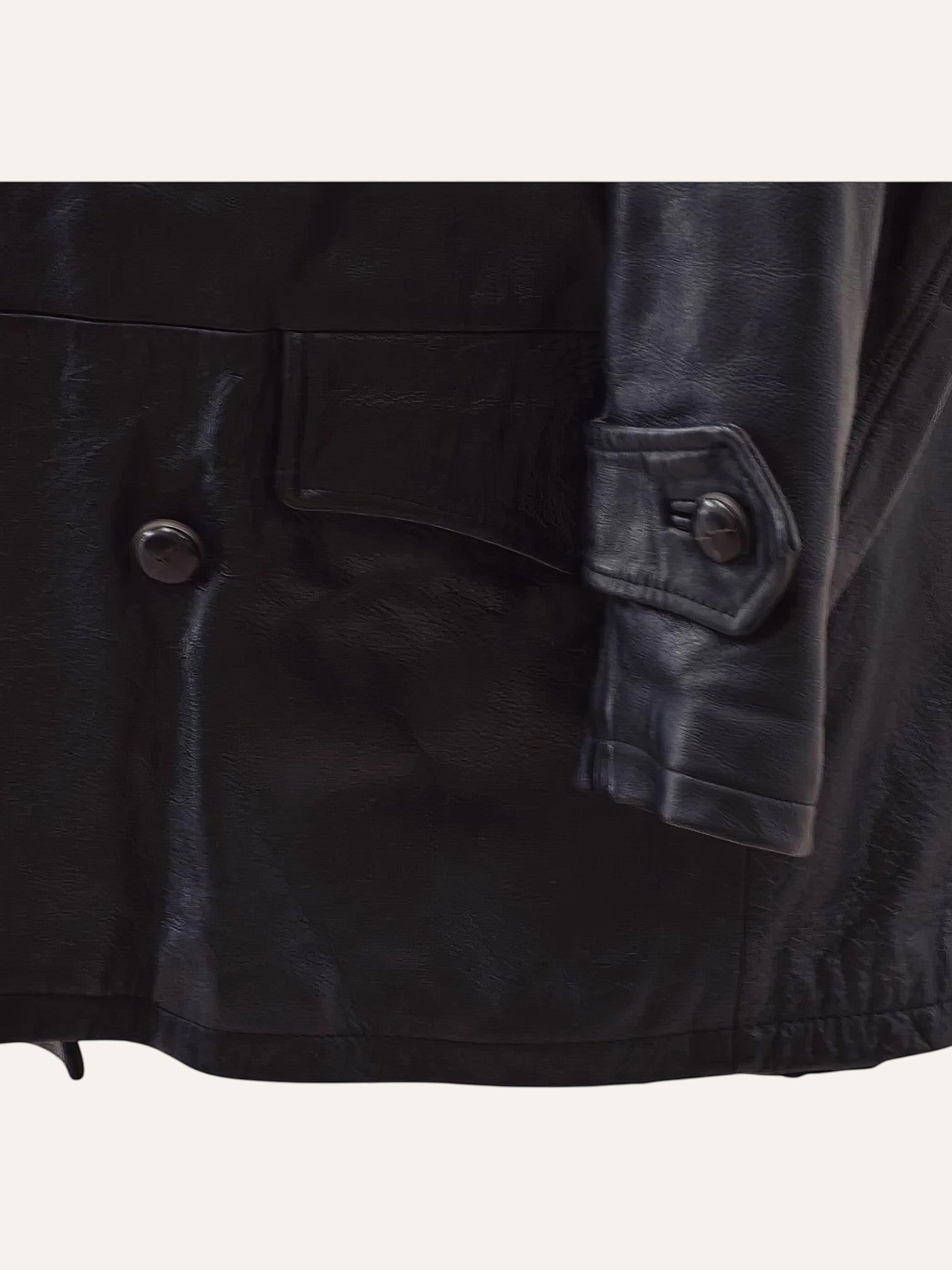 Anemoia Vestiaire black genuine leather trench coat with button closure and flap pocket detail.