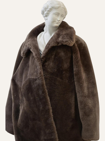 Anemoia Vestiaire brown luxury vegan fur teddy coat with wide lapels and oversized fit.