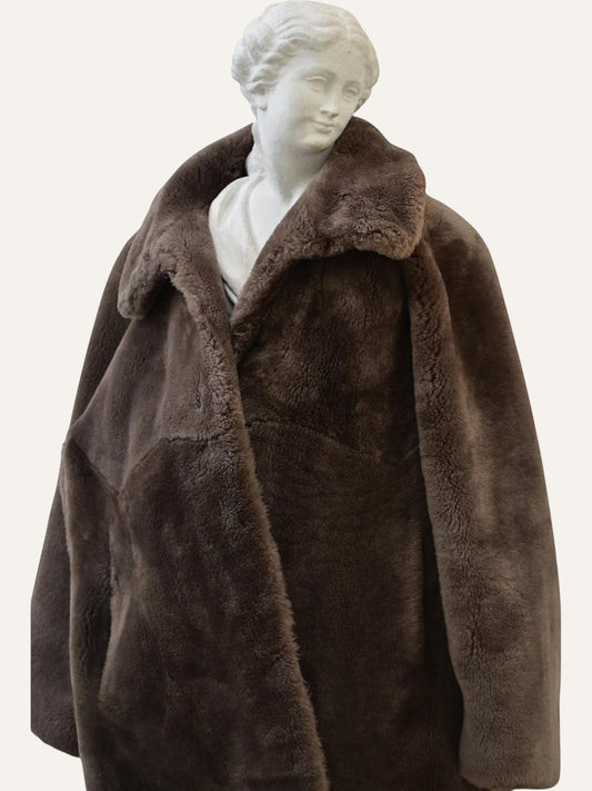 Anemoia Vestiaire brown luxury vegan fur teddy coat with wide lapels and oversized fit.