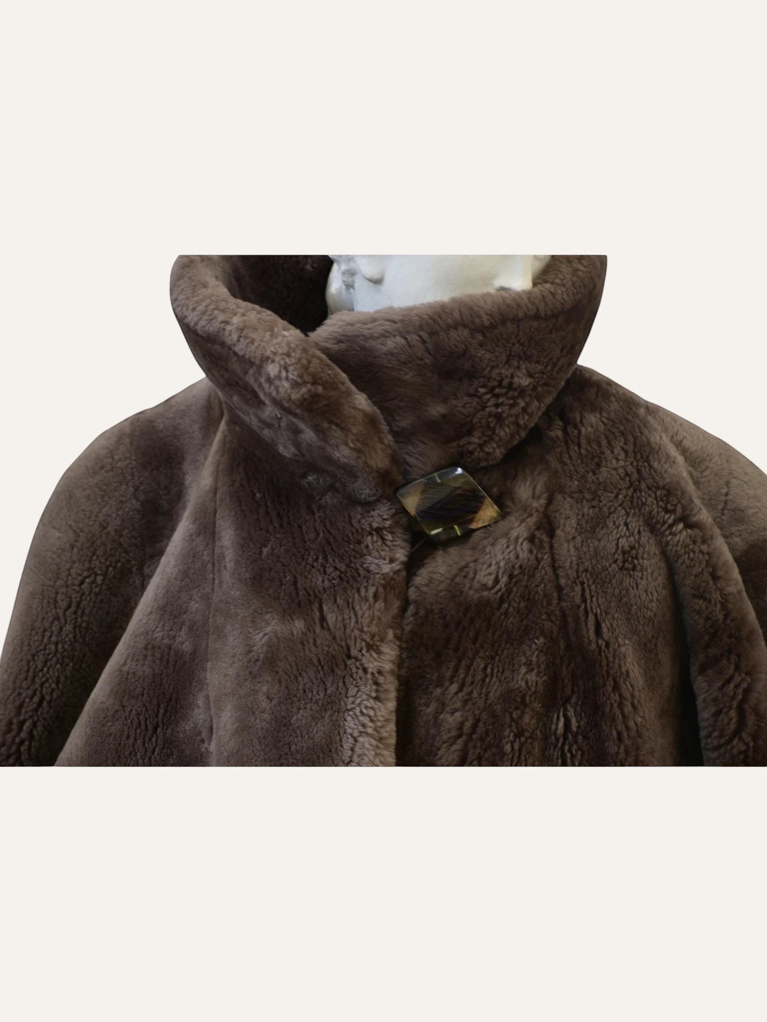Anemoia Vestiaire brown luxury vegan fur teddy coat with wide lapels and statement button closure.
