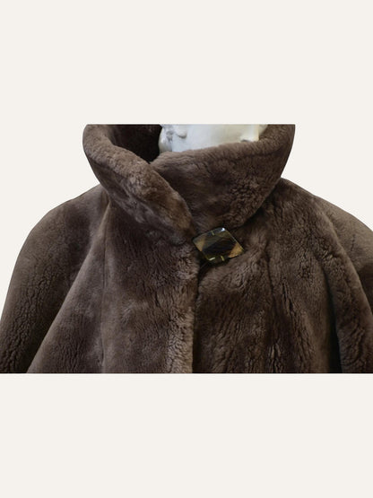 Anemoia Vestiaire brown luxury vegan fur teddy coat with wide lapels and statement button closure.