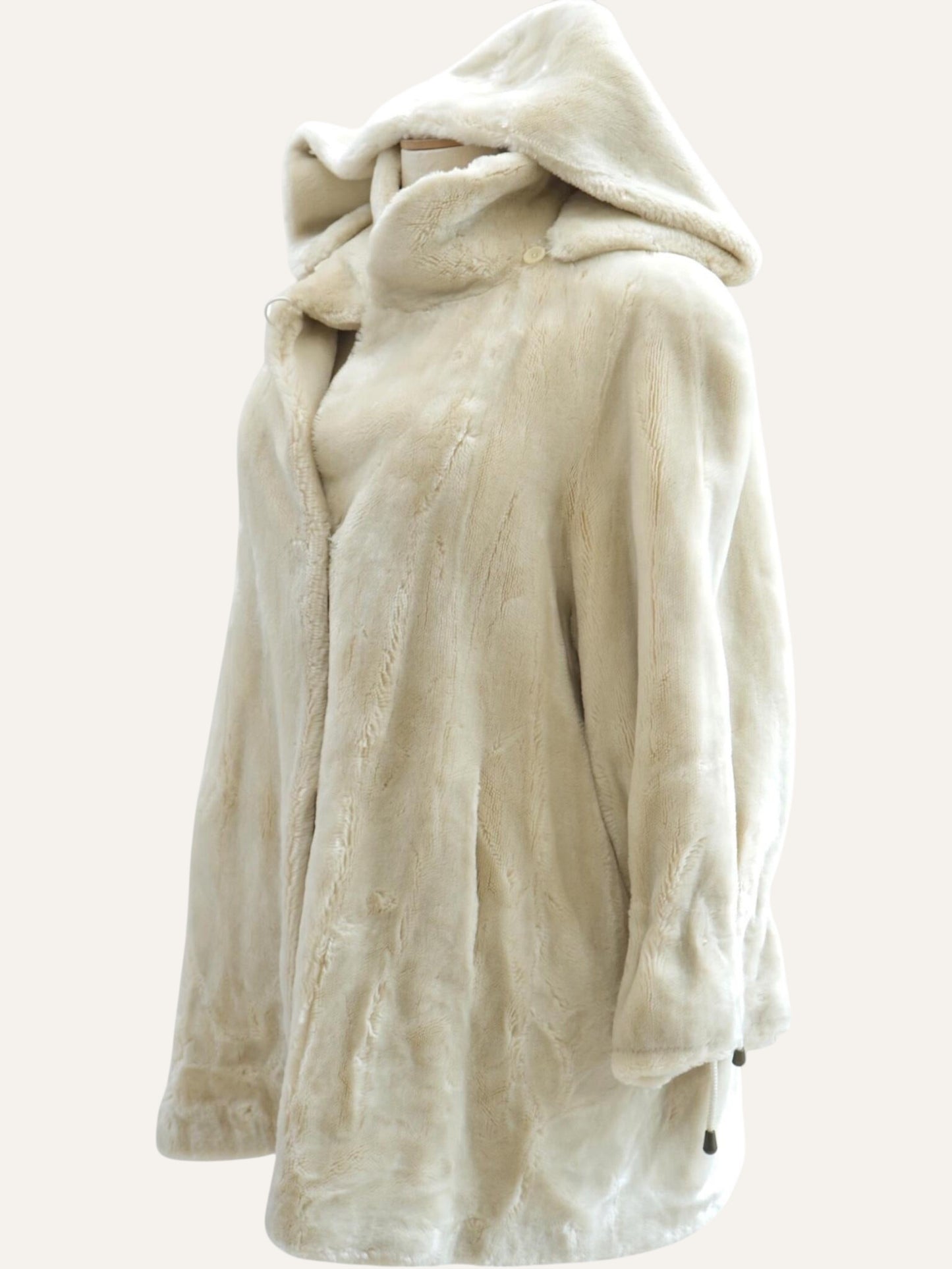 Anemoia Vestiaire ivory white hooded faux fur coat with a soft texture and full-front closure. Luxurious vegan winter jacket.