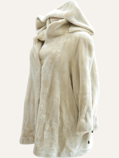 Anemoia Vestiaire ivory white hooded faux fur coat with a soft texture and full-front closure. Luxurious vegan winter jacket.