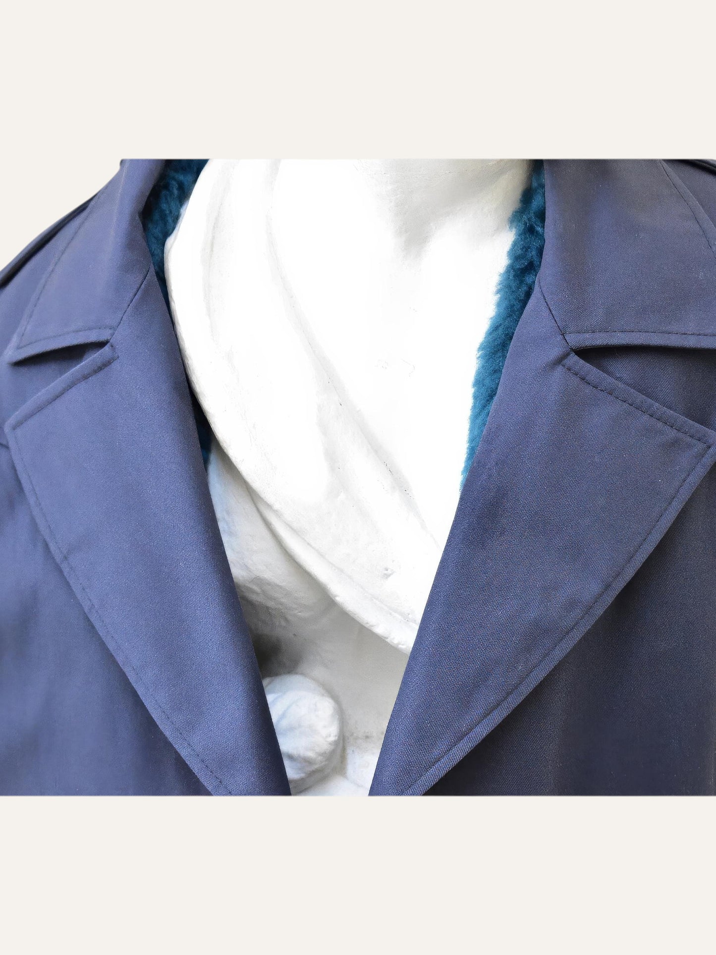 Anemoia Vestiaire navy blue cotton double-breasted trench coat with teal fur lining and notch lapels.