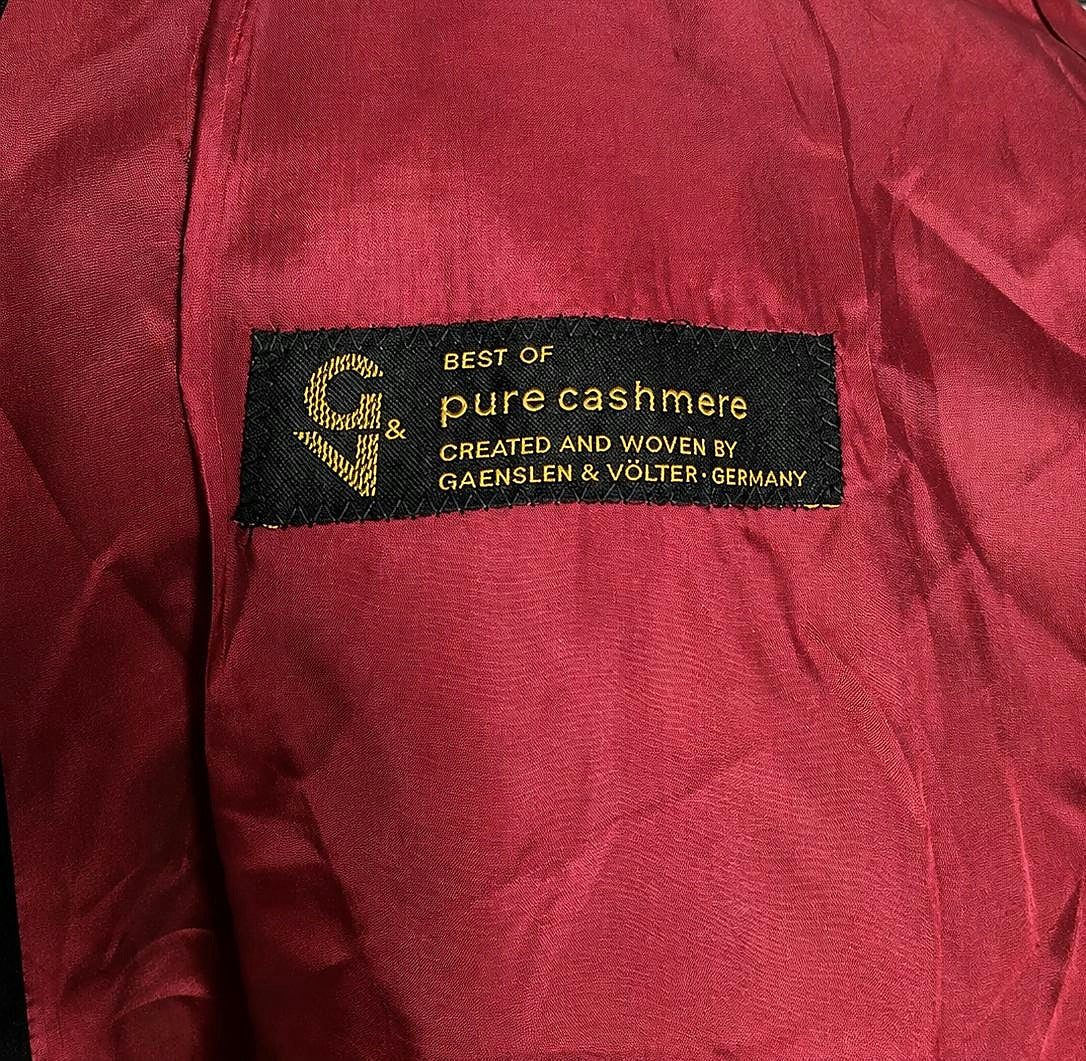 Cloth label reading pure cashmere created and woven by Gaenslen and Völter, Germany