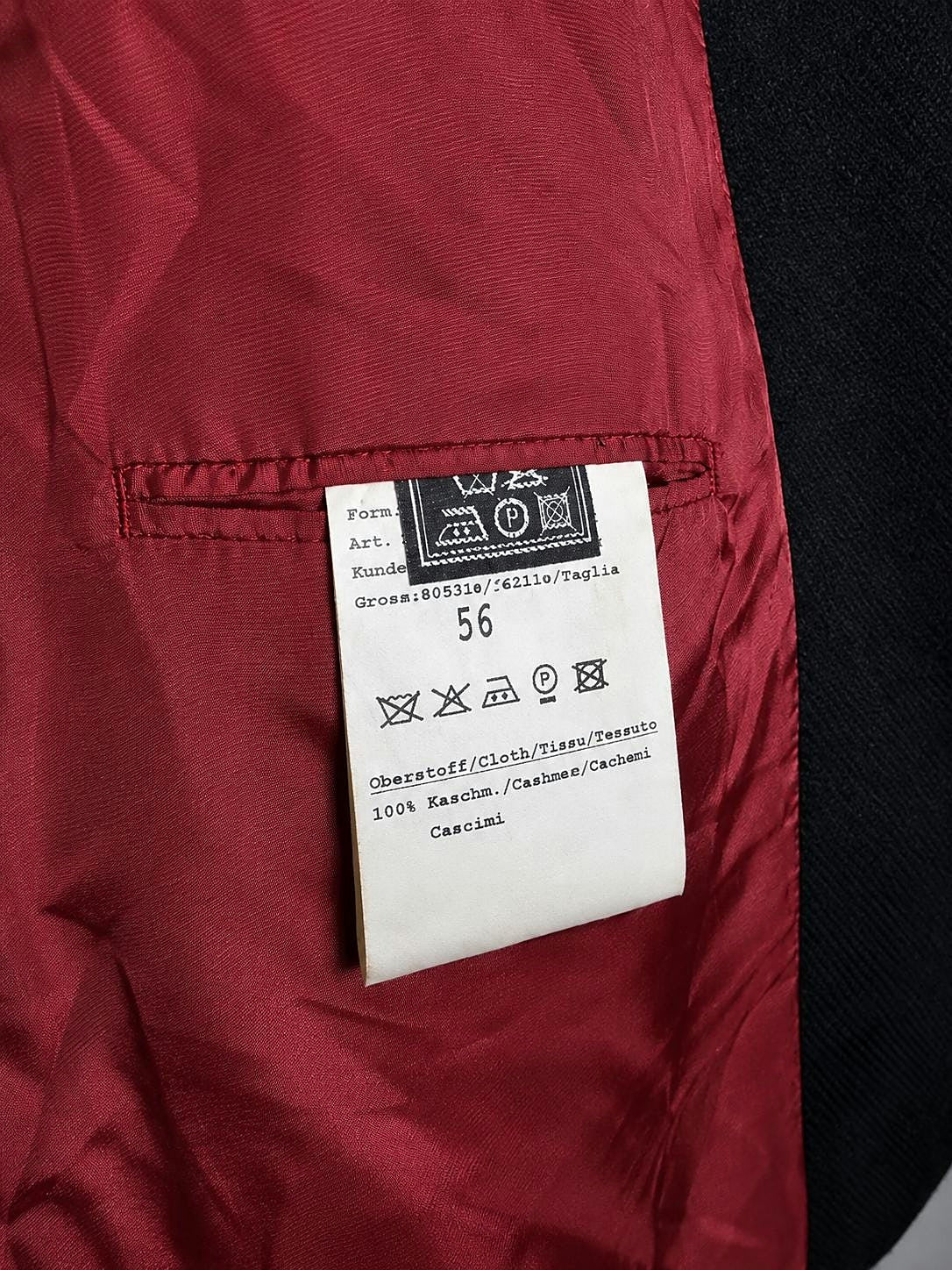 Care and size label showing size 56 inside the cashmere blazer