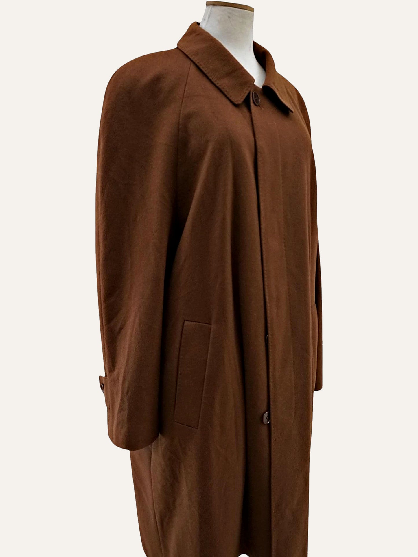 Camel cashmere overcoat side profile showing long minimalist silhouette