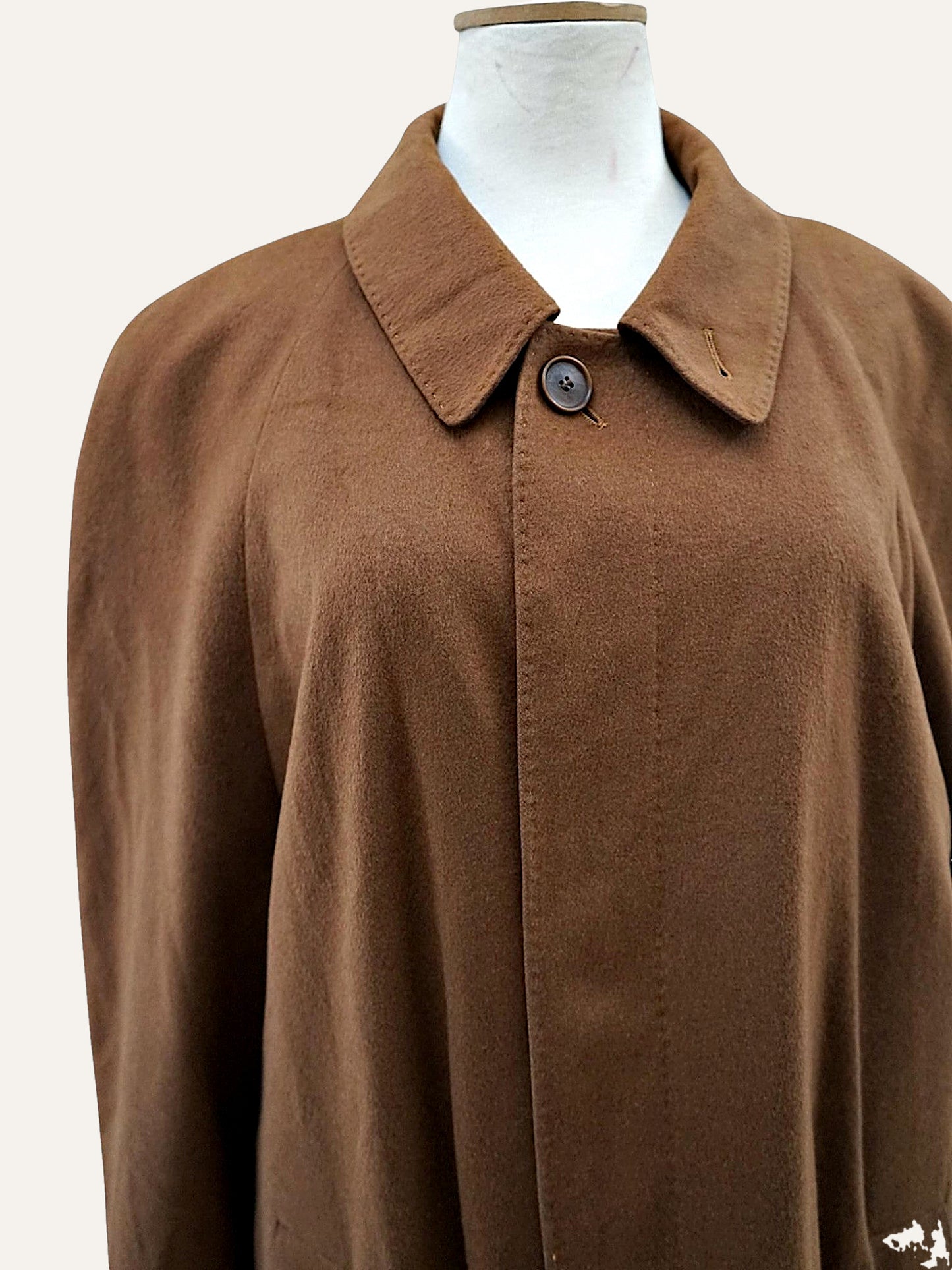 Camel cashmere overcoat detail of collar and button fastening
