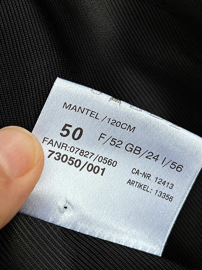 Interior label showing size 50 on the black cashmere overcoat