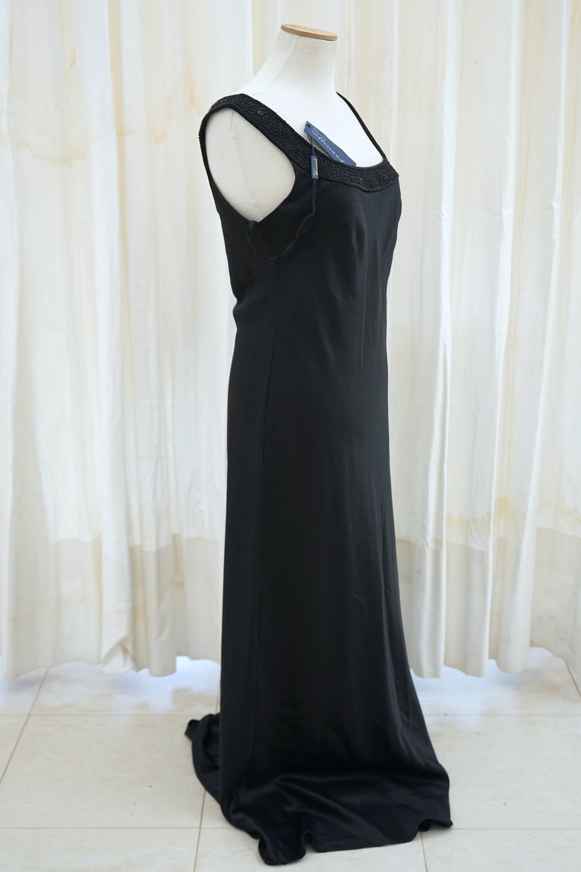 Black satin evening gown with open back