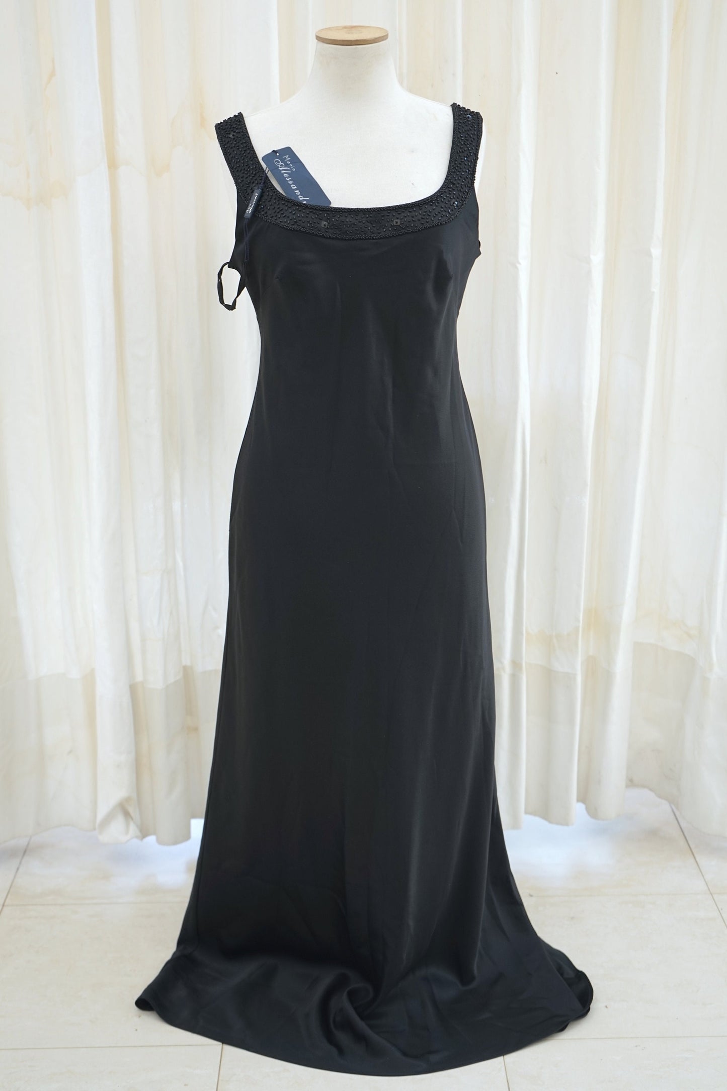 Black satin column gown with beaded neckline detail