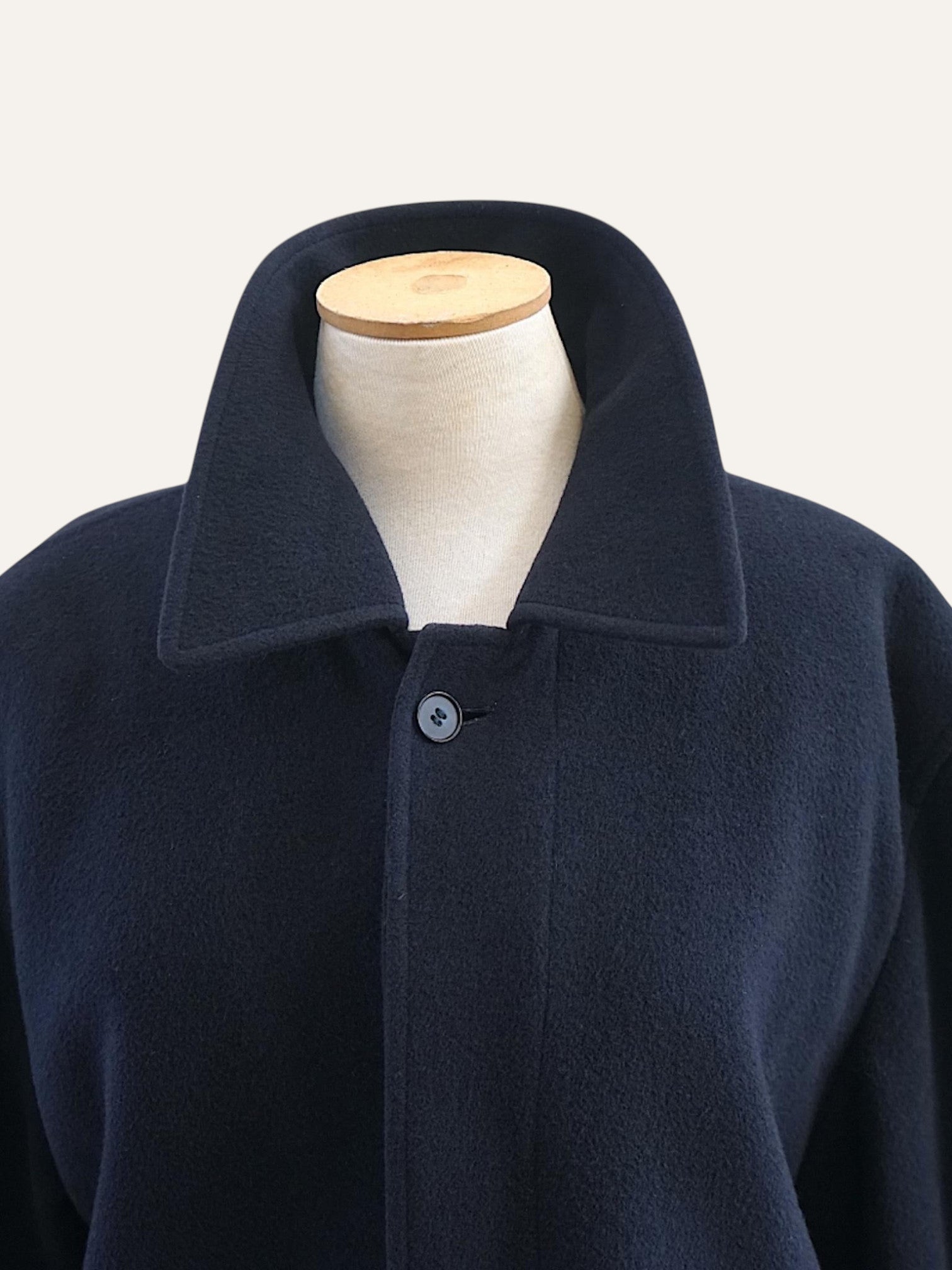 Navy wool raglan overcoat, minimalist
