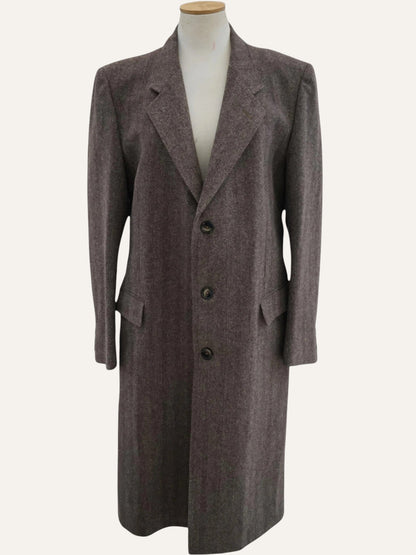 Brown coat on a mannequin against a white background