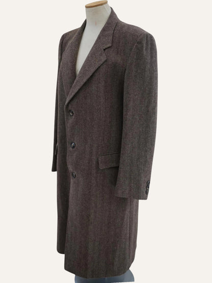 Brown coat on a mannequin against a white background