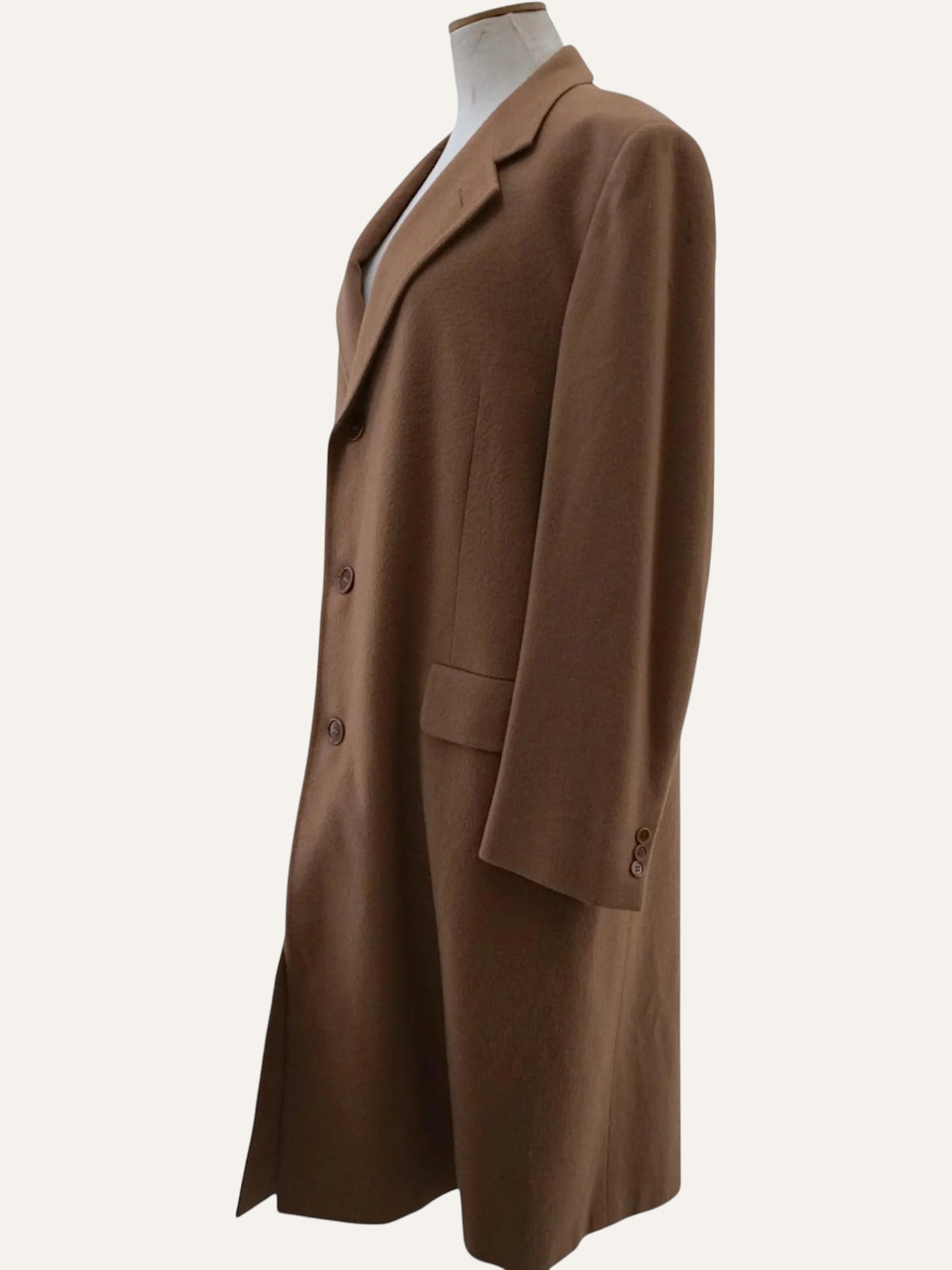 Brown coat on a mannequin against a white background