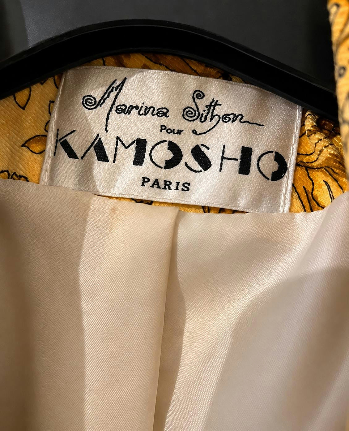 Interior label reading Marina Sitbon pour Kamosho Paris