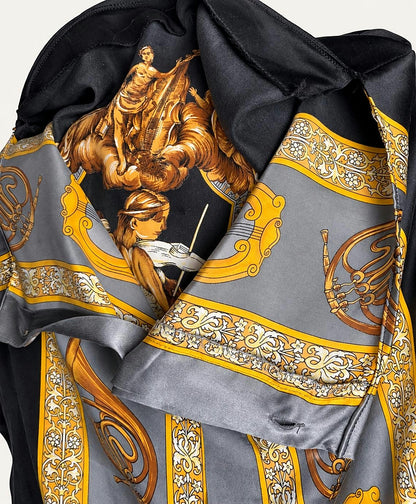 Close view of the winged figure and ornamental border print
