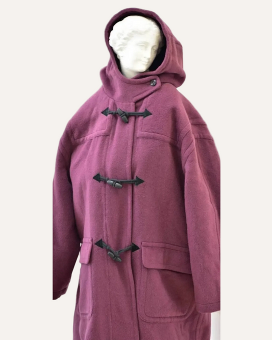 Purple coat with black buttons on a mannequin against a white background