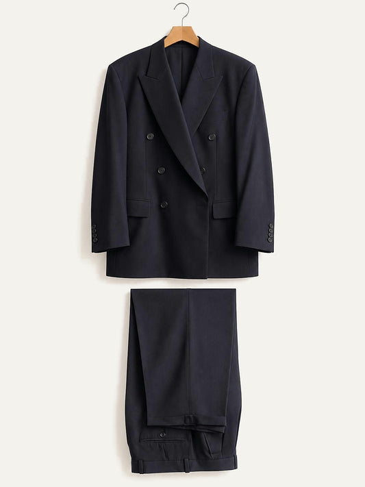 The navy silk suit shown as two pieces, jacket and trousers